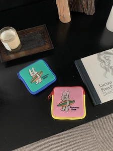 Close-up of square mini storage pouches with cartoon rabbit embroidery and summer time text