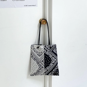 Large paisley canvas shoulder bag with black and white split design and drawstrings