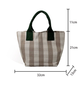 Detailed size guide of the canvas tote bag with 32cm width and green handles