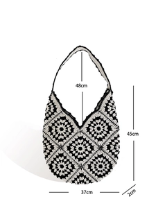 Handmade crochet shoulder bag with black and white knit patterns and size dimensions