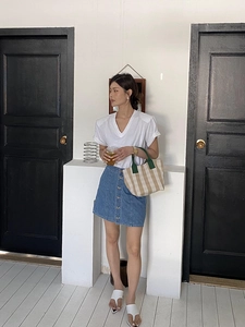 Minimalist checkered canvas tote bag styled with a summer outfit and denim skirt