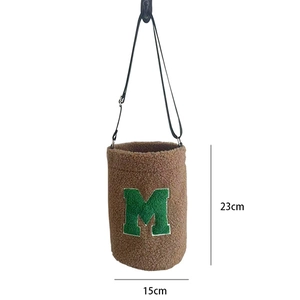 Brown fuzzy fleece bucket bag showing 23cm height and 15cm width dimensions
