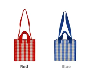 Detail view of red and blue checkered canvas tote bags with matching shoulder straps
