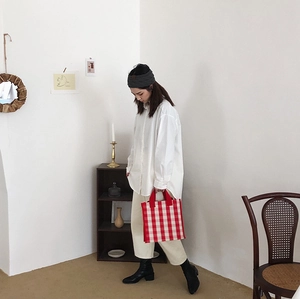 Chic red and white checkered canvas tote bag styled with a white shirt and casual outfit