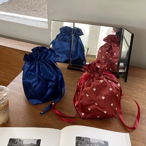 Blue and burgundy heart-patterned satin drawstring pouches for travel and makeup storage