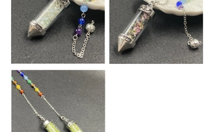 Detailed macro of crystal chip pendulum with Chakra beads and engraved metal tip