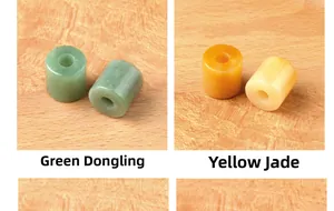 Detailed view of polished Green Aventurine and Topaz cylindrical stone beads for DIY