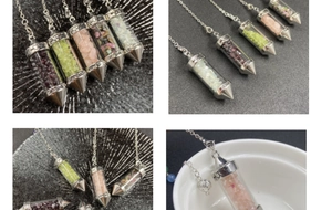 Macro detail of natural colorful crystal chips pendant with LOVE engraving and heart pattern