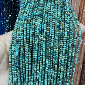 Close-up of 2-3mm faceted amazonite abacus beads with natural blue-green textures
