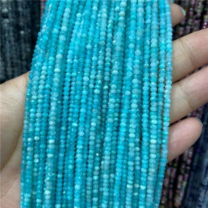 Close-up of 2-3mm faceted amazonite beads string for jewelry making in natural light