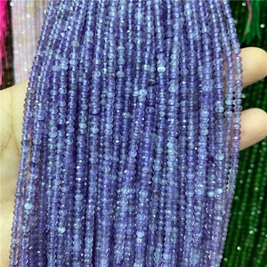 Close-up of 2x3mm faceted purple natural stone beads for DIY jewelry making and crafts
