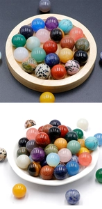 Close-up of polished 16mm assorted natural gemstones and amethyst spheres for DIY jewelry