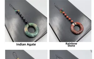 Detail of Indian Agate and Rainbow Stone pendants with black hand-woven cords