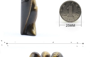Makroansicht des 25mm handgeschnitzten Tigerauges mit einzigartiger brauner Streifentextur