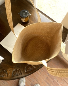 Top-down view of a spacious straw tote bag showing deep interior and spiral weave pattern