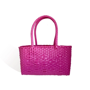 Pink purple hand-woven basket tote bag with textured crisscross pattern for summer style