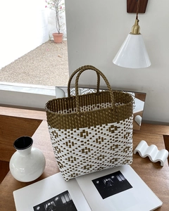Macro detail of olive green and white woven patterns on a durable rectangular beach tote