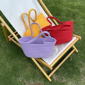 Detailed knit texture of lavender, yellow and red handmade cotton rope beach tote bags