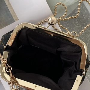 Retro print clasp bag with dark gold floral pattern and gold bead chain strap