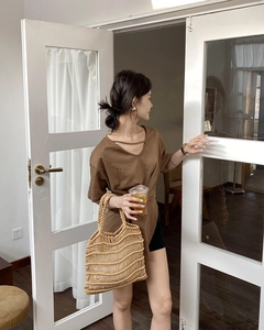 Chic summer look featuring a hand-woven straw tote bag with casual city outfit
