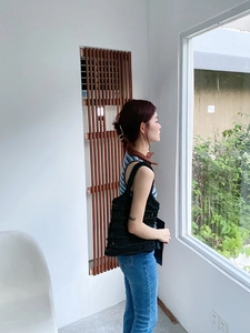 Detailed texture of black woven mesh tote bag with lightweight hollow structure design