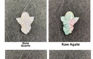 Detailed comparison of hand-carved rose quartz and raw agate angel wing pendants