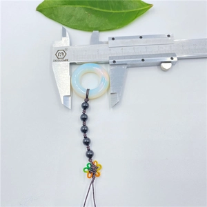 Handmade woven opal ring charm for keychains or cars showing 23mm diameter measurement