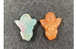 Detailed view of hand-carved agate and jade angel pendants for DIY jewelry making