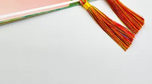 Macro shot of colorful silk tassel with golden ring for Seven Chakras car ornament
