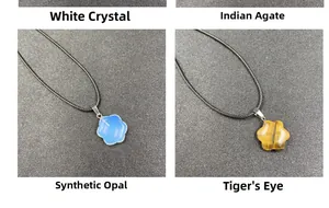 Detail of flower-shaped pendants in quartz, agate, opalite, and tiger's eye with cords