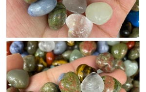 Macro detail of various polished heart-shaped natural gemstones and tumbled stones set