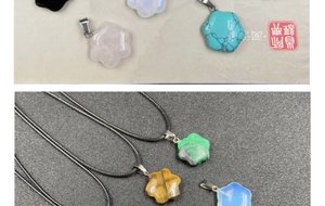 Close-up of flower-shaped stone pendants in obsidian and opal with wax rope necklace