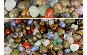 Close-up of polished natural heart-shaped crystals and mixed semi-precious gemstones