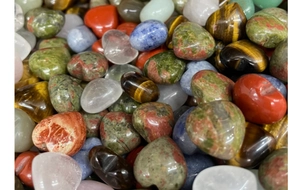Polished natural crystal heart-shaped stones and smooth colorful gemstone pebbles