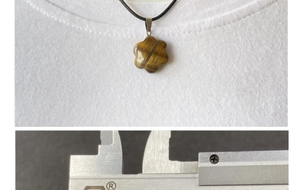 Detail view of flower-shaped tiger eye stone pendant necklace with size measurement guide