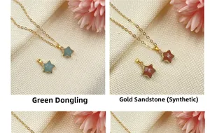 Detail of star-shaped aventurine and goldstone pendants on delicate golden chains