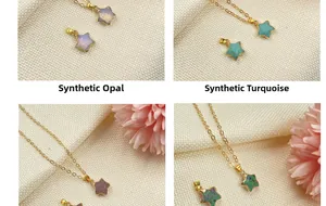 Detail of star-shaped pendants featuring synthetic opal and turquoise on gold necklaces