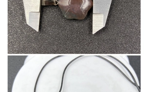Detail showing hexagram flower stone pendant dimensions measured by a caliper tool