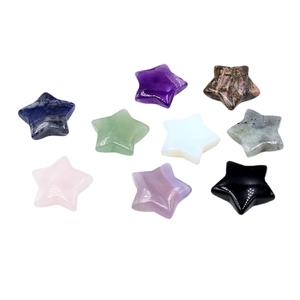 Nine colorful polished crystal star stones including amethyst and quartz on white background
