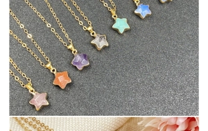 Macro shot of assorted star pendants in amethyst rose quartz and amethyst with gold chains