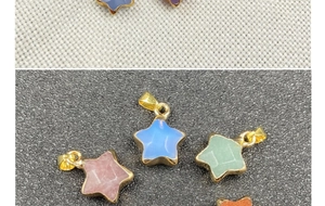 Close-up of star-shaped semi-precious stone pendants with gold-plated metal borders