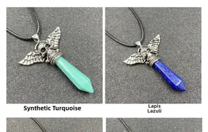 Detail of gothic punk skull and wing pendant with turquoise and lapis lazuli crystals