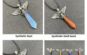 Detail of gothic skull winged pendant with synthetic opal and goldstone crystal points