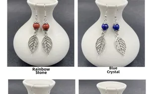 Close-up of lapis lazuli and red jasper leaf drop earrings with silver hooks