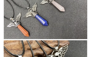 Detail of gothic skull pendants with wings and hexagonal crystals in three colors