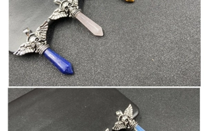 Macro detail of winged skull pendants with assorted hexagonal crystal quartz stones