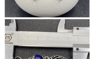 Detailed measurement of silver leaf earring with blue lapis lazuli using a caliper