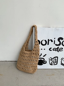 Minimalist beige crochet shoulder bag with hollow knit pattern for summer beach use