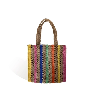 Large colorful striped straw tote bag for summer beach travel with handmade woven texture