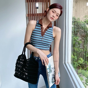 Retro striped sleeveless knit polo shirt with brown collar and lace-up detail